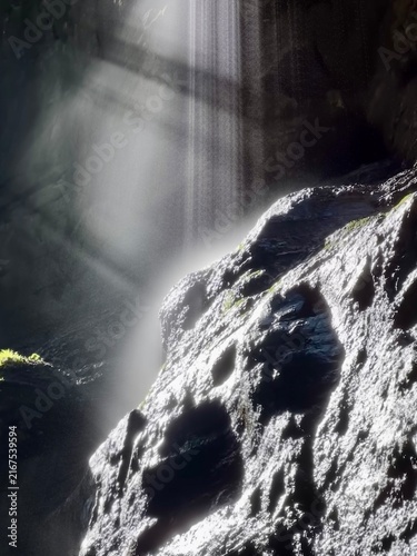 Breathtaking Partnachklamm Gorge in the Bavarian Alps, Germany, featuring dramatic limestone cliffs, crystal-clear rushing water, and lush green vegetation. 