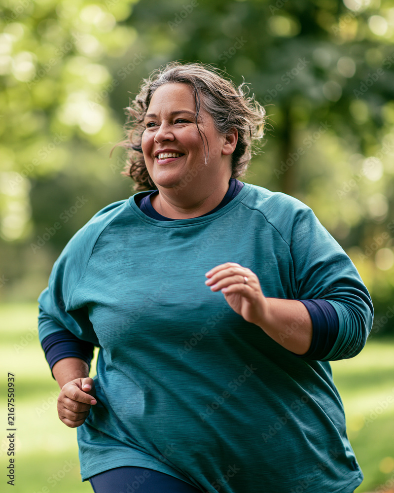 Fototapeta premium Plus size woman exercising outdoors