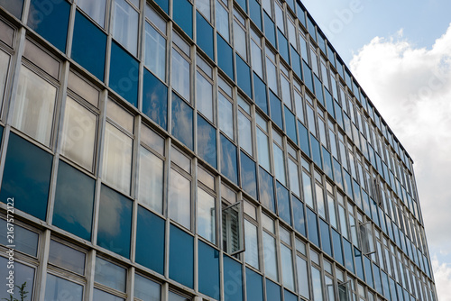 Modern office building facade with reflective glass windows