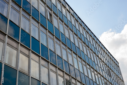 Modern office building facade with reflective glass windows