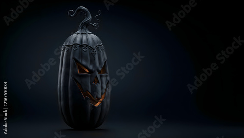 Black Halloween pumpkin jack-o-lantern glowing in the dark with scary carved face on dark background with empty space