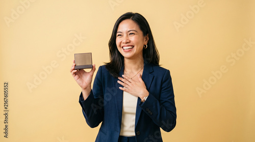 Happy Successful Asian Businesswoman Holding Award and Celebrating Career Achievement