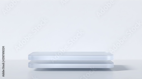 Close-up of blank white plastic card or ID badge isolated on light background