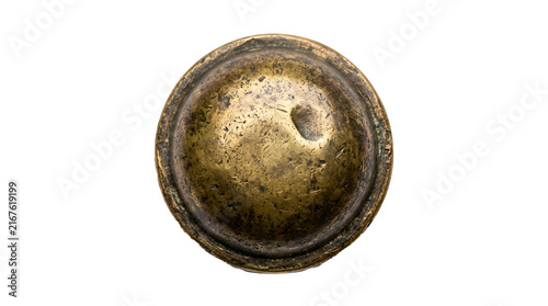Distressed antique brass door knob featuring a circular weathered metallic surface with rich golden tones isolated against a clean white background for industrial design hardware projects.