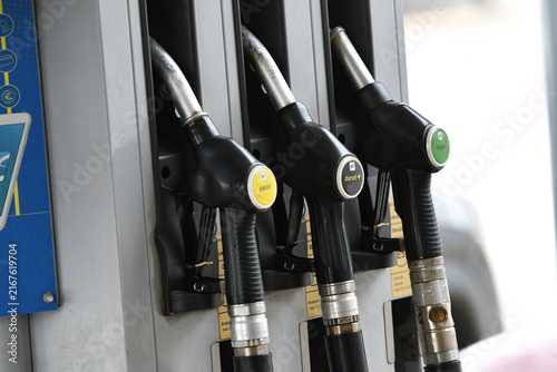 Obraz na plátne Fuel pump nozzles at a service station