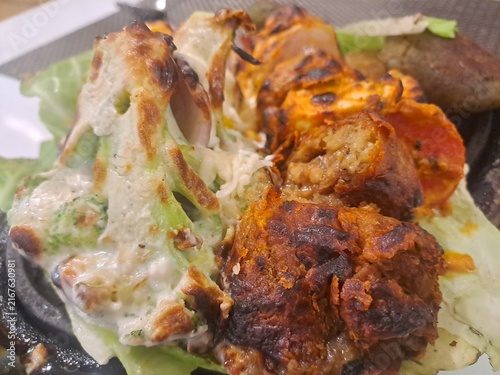 Closeup of veg tandoori sizzler platter