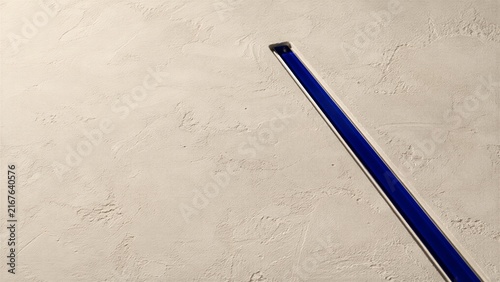 Cobalt Glass Seam Across Tactile Lime Plaster Background for Web Design