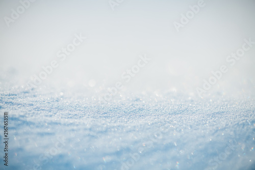 Fotografie Sparkling snow crystals creating a textured surface, reflecting sunlight and for