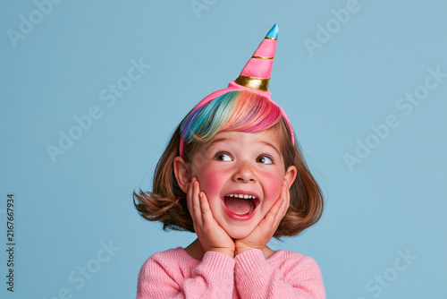 Excited Girl Wearing Colorful Unicorn Headband
