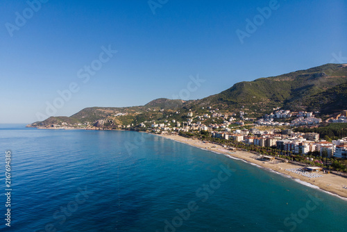 Canvastavla Aerial panorama of Cleopatra Beach in Alanya, beautiful Mediterranean Sea coast line with resort hotels and green mountains, scenic Turkey travel destination