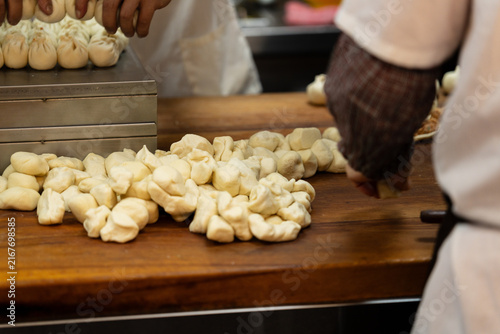 Steamed Bun Preparation At Restaurant Counter Outdoor Scene