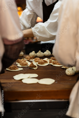 Steamed Bun Preparation At Restaurant Counter Natural Light