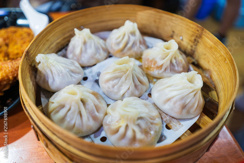 Steamed Soup Dumplings In Bamboo Basket Outdoor Scene