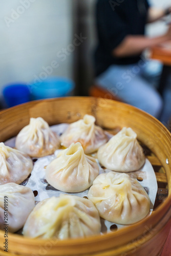 Steamed Soup Dumplings In Bamboo Basket Wide View