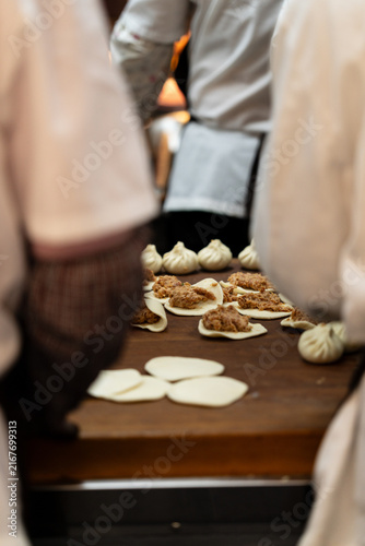 Steamed Bun Preparation At Restaurant Counter Foreground Focus