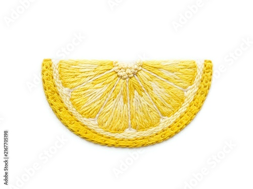 Bright yellow lemon slice with detailed texture and white pith