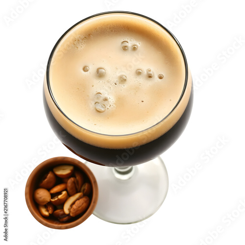 Traditional Belgian beer poured into a branded glass with rich golden color and creamy foam isolated.
