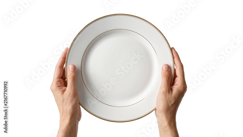 фотографія Two hands holding a white ceramic plate with gold rim, isolated on transparent b