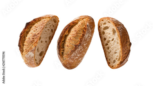 Картината върху платно Artisan sourdough bread halves with golden crust and airy crumb, isolated on tra
