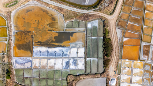 Fotografía Aerial drone top-down view of Guerande salt marshes geometric pools and reflecti