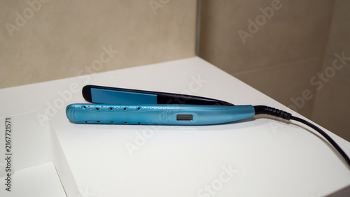 A blue hair straightener.