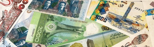 Algerian dinar money bills in pile on table. Algeria DZD currency cash close up