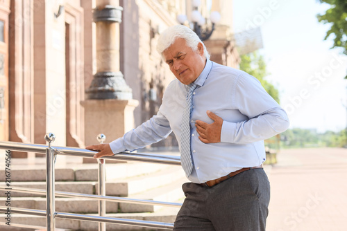 Foto Heart attack and chest pain, senior man suffering from sudden cardiac arrest or