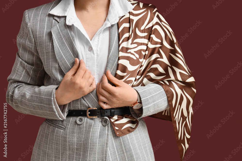Fototapeta premium Business fashion and professional style, woman in pinstripe suit with zebra print scarf, elegant corporate attire