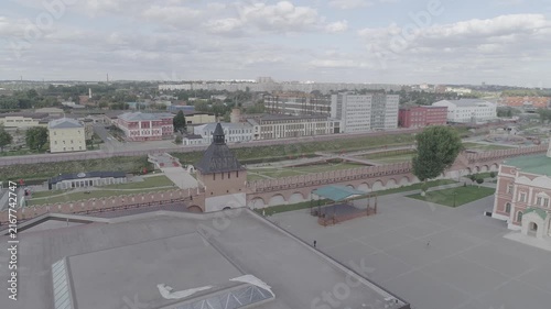 Drone flying over temple complex toward river