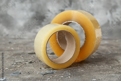 Fotografie Adhesive tape rolls on grey background