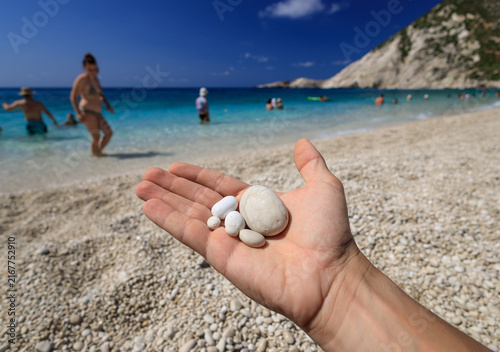 A photograph of the white pebbles typical of the beautiful, azure Paralia Petani beach