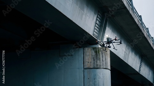 Obraz na płótnie Drone Inspecting Bridge Structure and Support Column