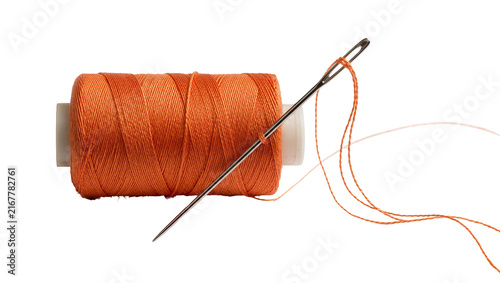 Cuadro en lienzo Orange thread spool with needle threaded, isolated on transparent background