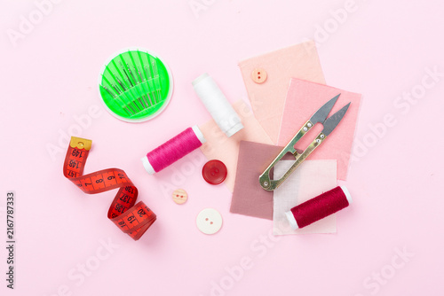 Quadro su tela Sewing and needlework accessories on color background, top view