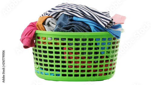 Full green plastic laundry basket overflowing with colorful clothes, isolated on transparent background
