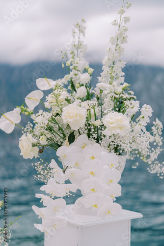 Elegant white floral wedding arrangement outdoors