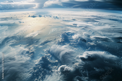 Planet Earth seen from orbit, showcasing swirling cloud formations and the vast expanse of the blue ocean, highlighting the beauty and fragility.