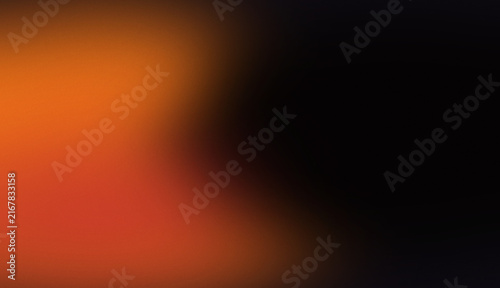Abstract blurred background with warm orange and red light gradients and grainy texture