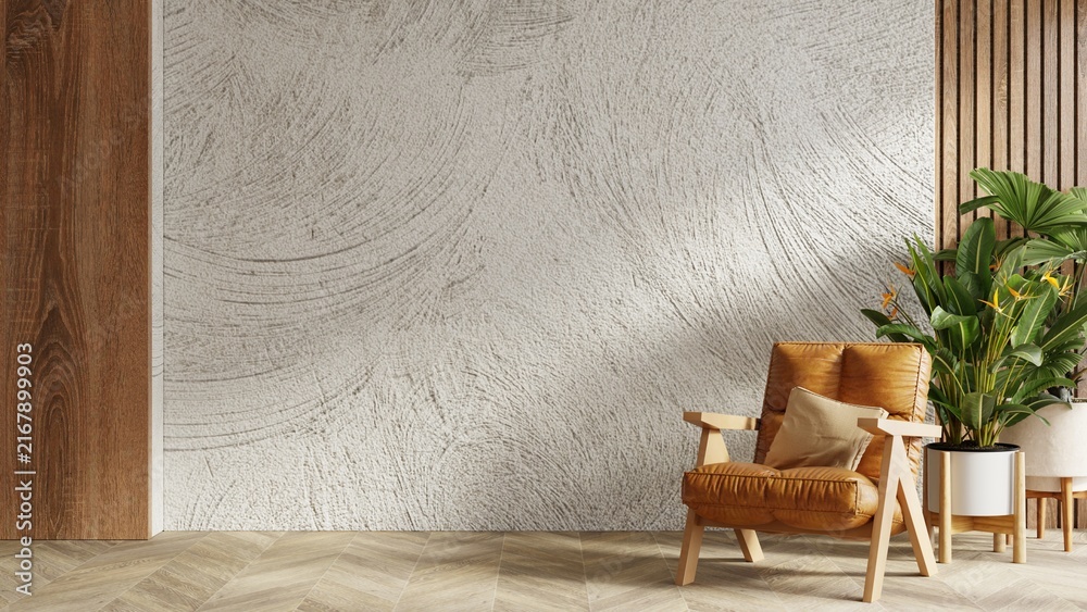 Naklejka premium Minimalist modern empty room interior design with brown leather armchair and tropical green plant against textured white wall and wooden panel background- 3D rendering