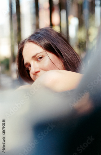 Photography Candid woman looking back with vintage film grain