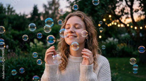 Young Woman Enjoying Bubbles Outdoors During Sunset.