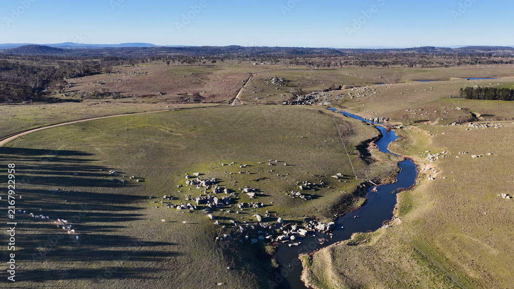 Fototapeta premium Aerial View of a Winding River Through Rural Uralla Countryside