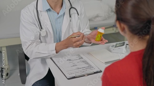 Doctor explaining medication and prescription to patient