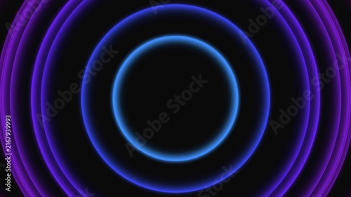 Abstract concentric neon rings expanding outward with vibrant purple and cyan glowing gradient effect pulsing seamlessly across dark minimal background footage.
