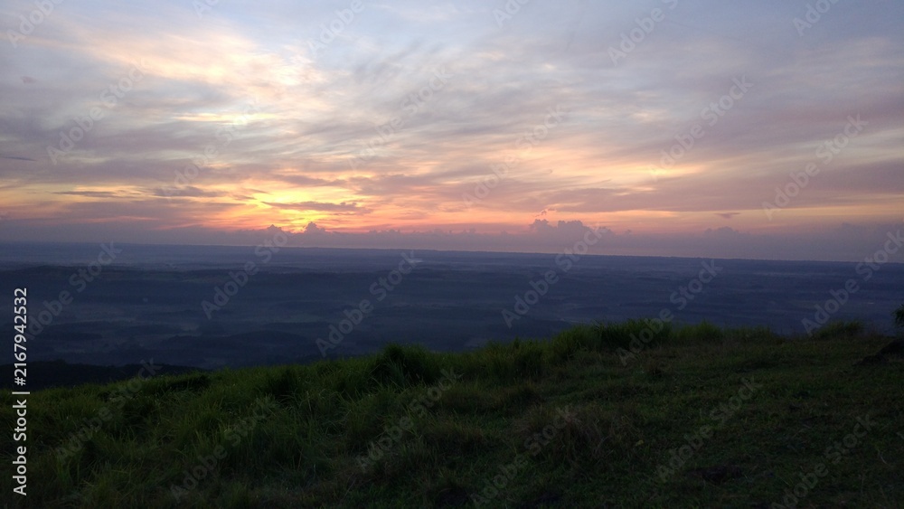 Naklejka premium sunset over the mountains