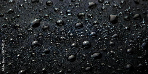 Water droplets on dark textured surface macro background with droplets moisture background condensation abstract refreshing