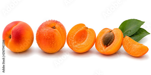 Fresh apricots with whole halved sliced pieces and leaves isolated background horizontal composition nutrition