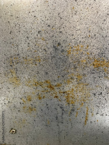 Vertical image of a stainless steel kitchen backsplash.