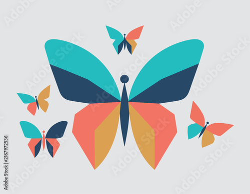 Colorful paper butterflies with vibrant wings in flight.