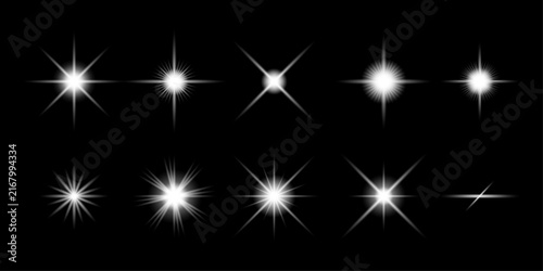 A collection of various white star burst shapes featuring a glowing light effect on black background